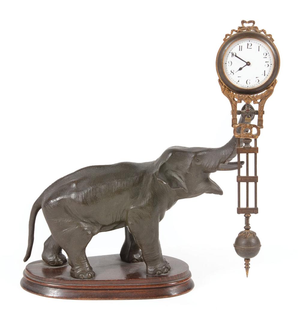 Appraisal: Continental Patinated Metal Figural Swinging Clock c probably Junghans Germany