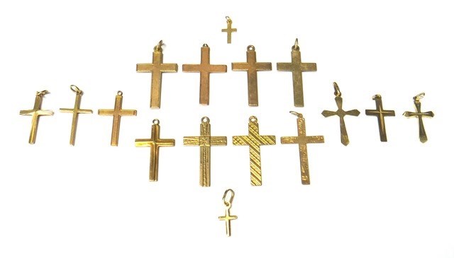 Appraisal: Sixteen mostly ct gold pendant crosses and charms in a