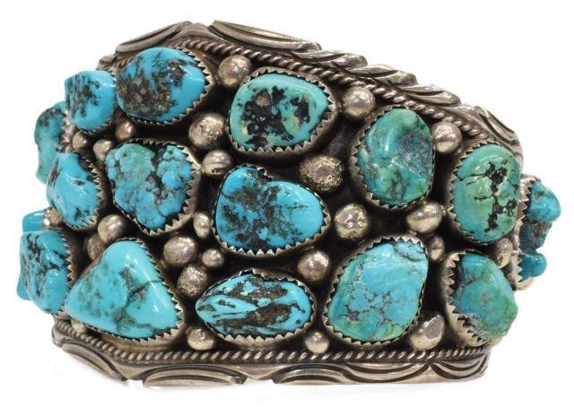 Appraisal: Native American silver content unknown cuff bracelet nineteen bezel-set turquoise