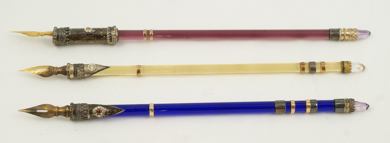 Appraisal: K sterling mounted crystal pens in amethyst cobalt and amber