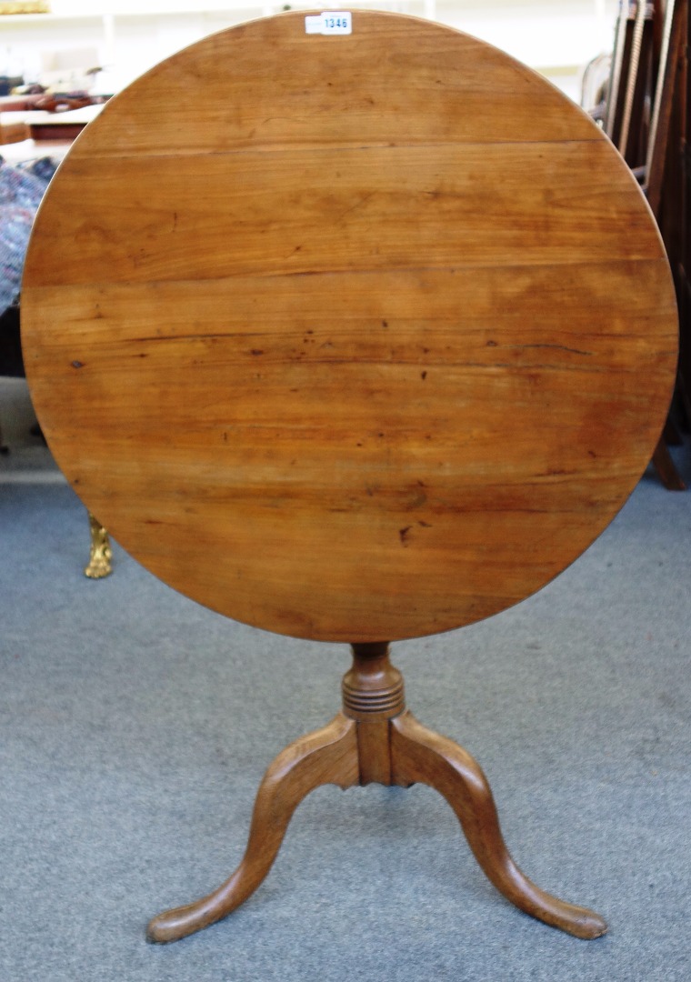 Appraisal: A George III snap top tripod occasional table with cherry