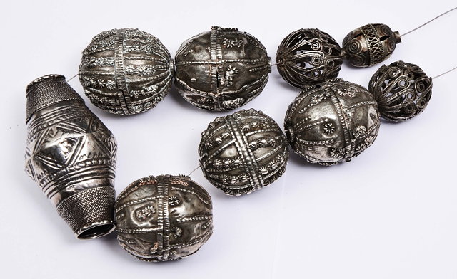 Appraisal: A YEMENI SILVER BEADS NECKLACE nine beads with differing patterns