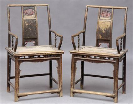 Appraisal: PAIR OF CHINESE BLACK-STAINED ELM ARMCHAIRS Each with central vertical