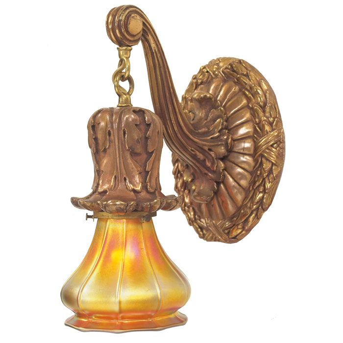 Appraisal: Arts and Crafts sconce with Steubenshade deeply carved brass fixturesupports