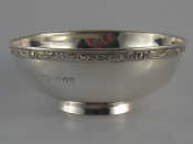 Appraisal: A circular silver bowl on raised foot the stiffened rim