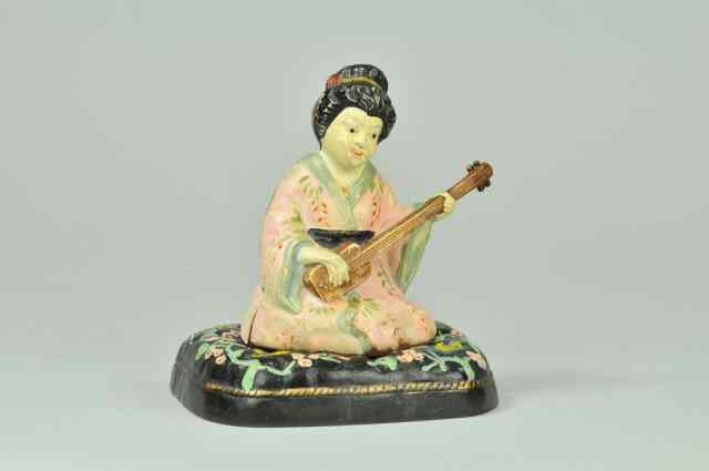 Appraisal: GEISHA ON FLORAL CUSHION DOORSTOP BOOK EXAMPLE Hubley two piece