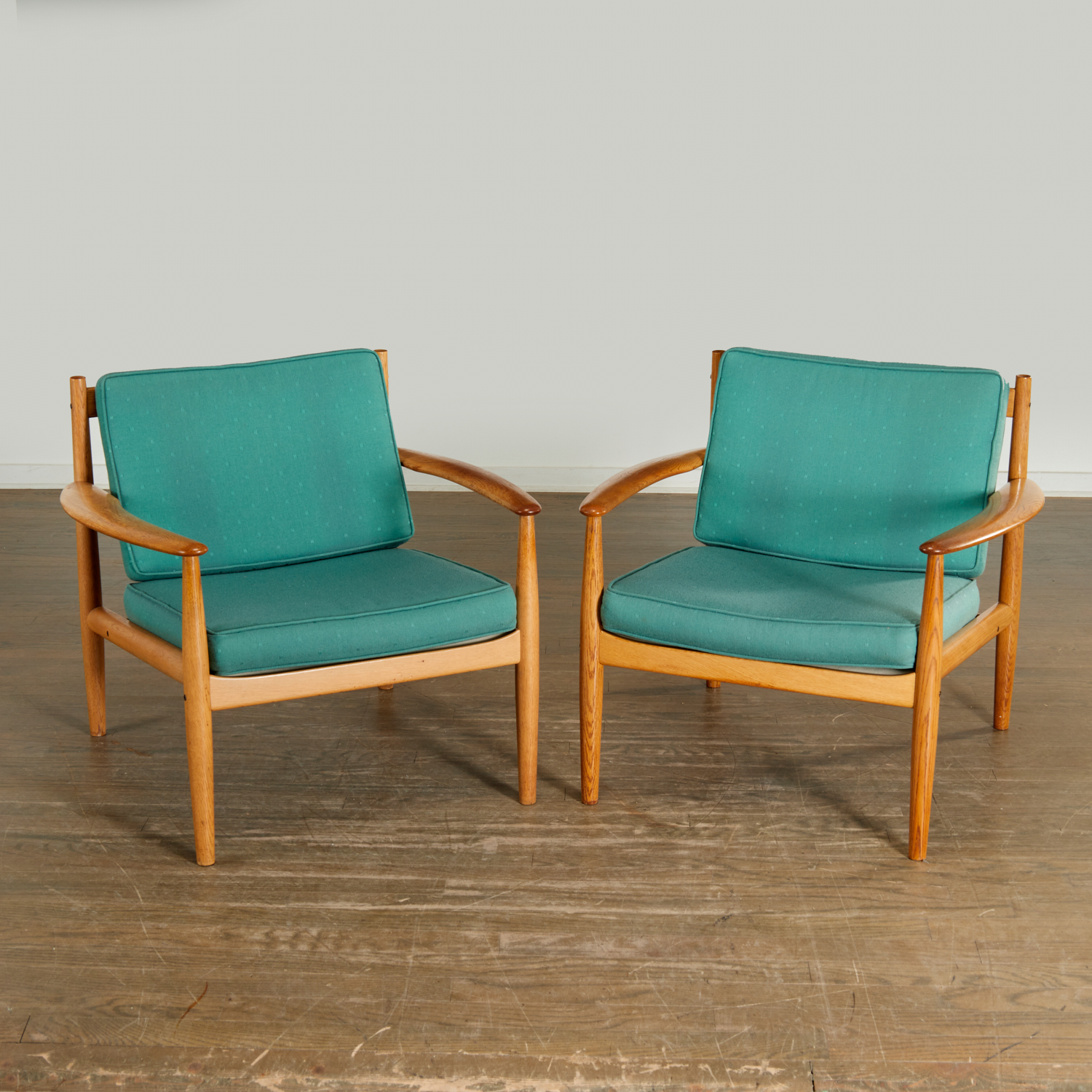 Appraisal: GRETA JALK PAIR MODEL OAK LOUNGE CHAIRS c Denmark solid