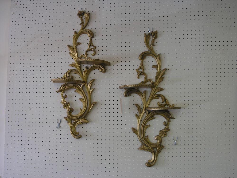 Appraisal: A pair of gilt metal wall shelves cast in rococo