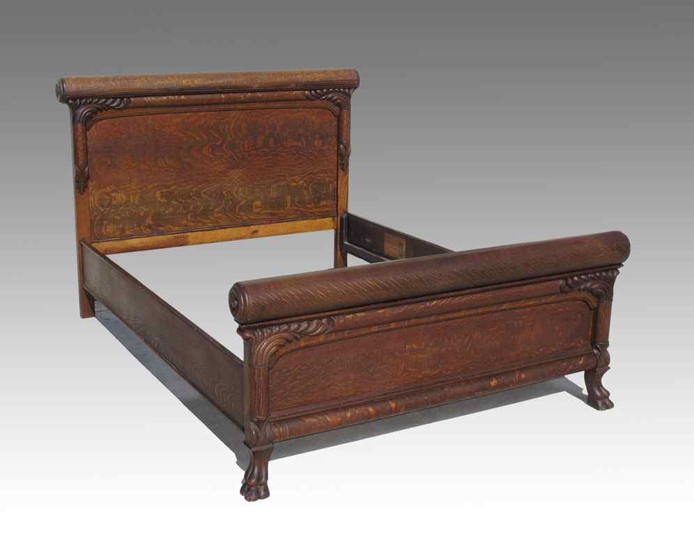 Appraisal: STATESVILLE FURNITURE COMPANY TIGER OAK PAW FOOT BED Double bed