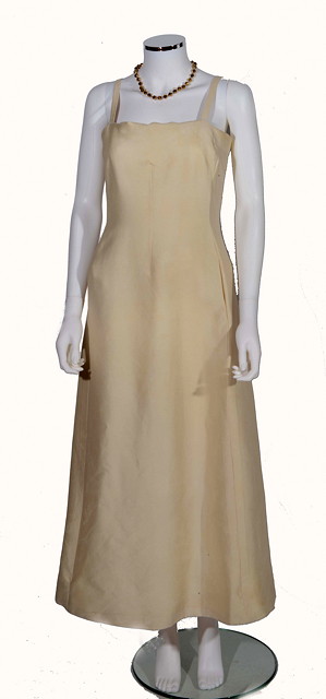 Appraisal: A VINTAGE 'CHRISTIAN DIOR BOUTIQUE' CREAM SATIN DRESS thin shoulder