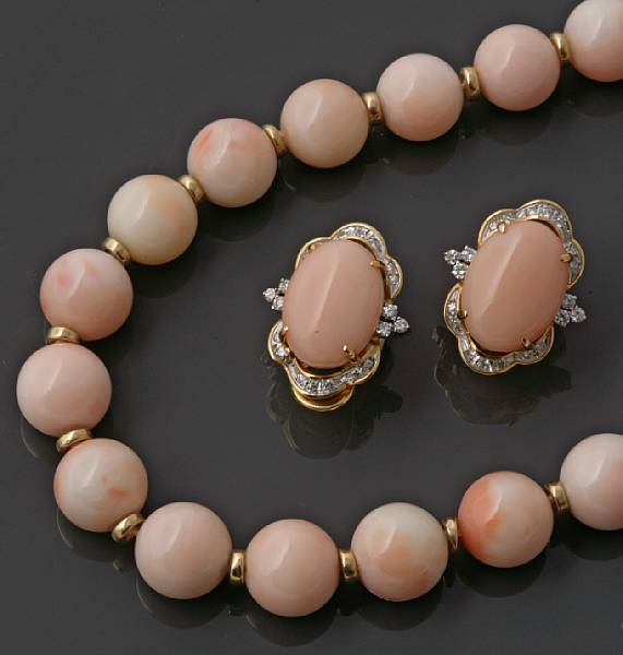 Appraisal: A strand of coral beads with a pair of coral