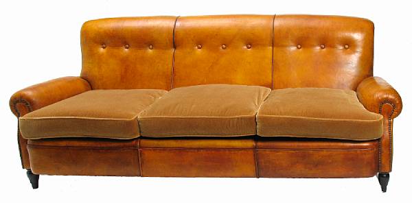 Appraisal: A contemporary leather upholstered sofa with tan leather seat cushions