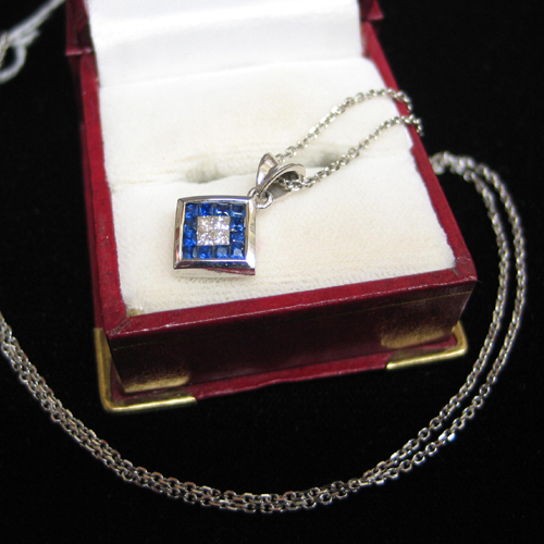 Appraisal: BLUE SAPPHIRE DIAMOND AND FOURTEEN KARAT WHITE GOLD PENDANT NECKLACE