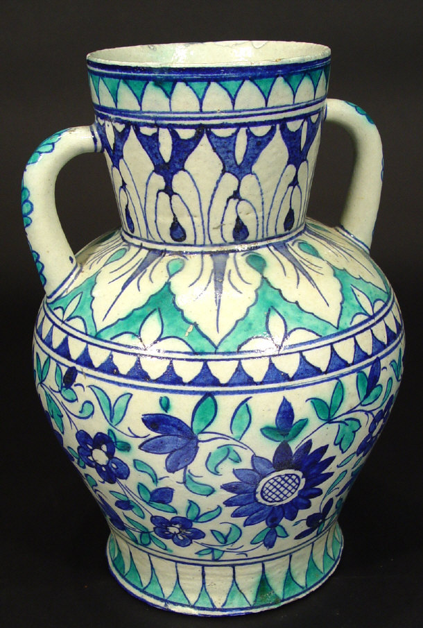 Appraisal: Isnik two handled vase hand painted with blue flowers cm