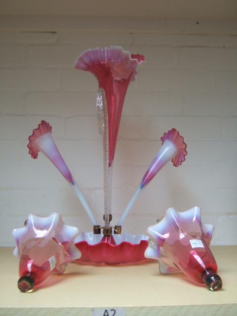 Appraisal: A cranberry and vaseline glass flower head epergne late th