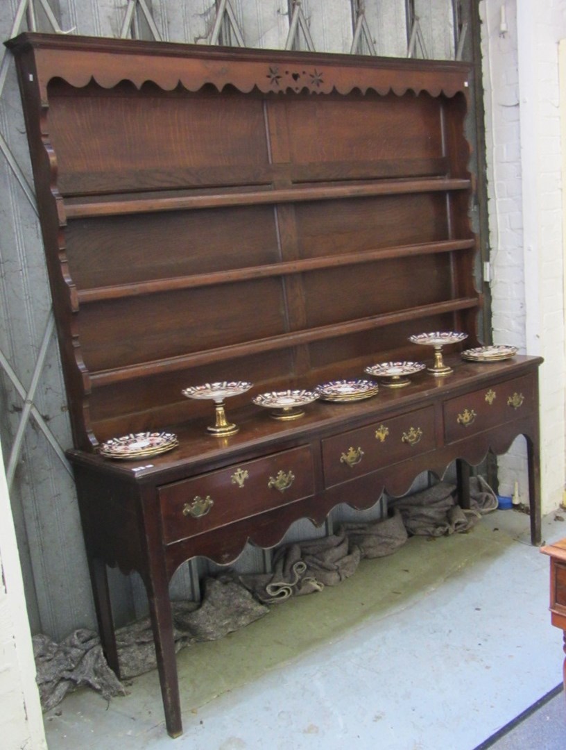 Appraisal: A mid th century oak dresser with enclosed three tier