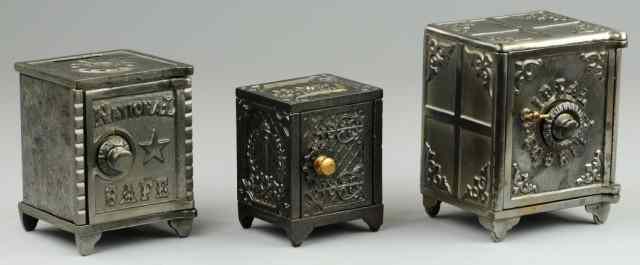 Appraisal: THREE VAULT SAFE STILL BANKS Cast iron grouping all are