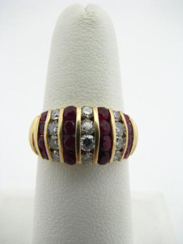 Appraisal: K Yellow gold ring with channel set rubies and diamonds