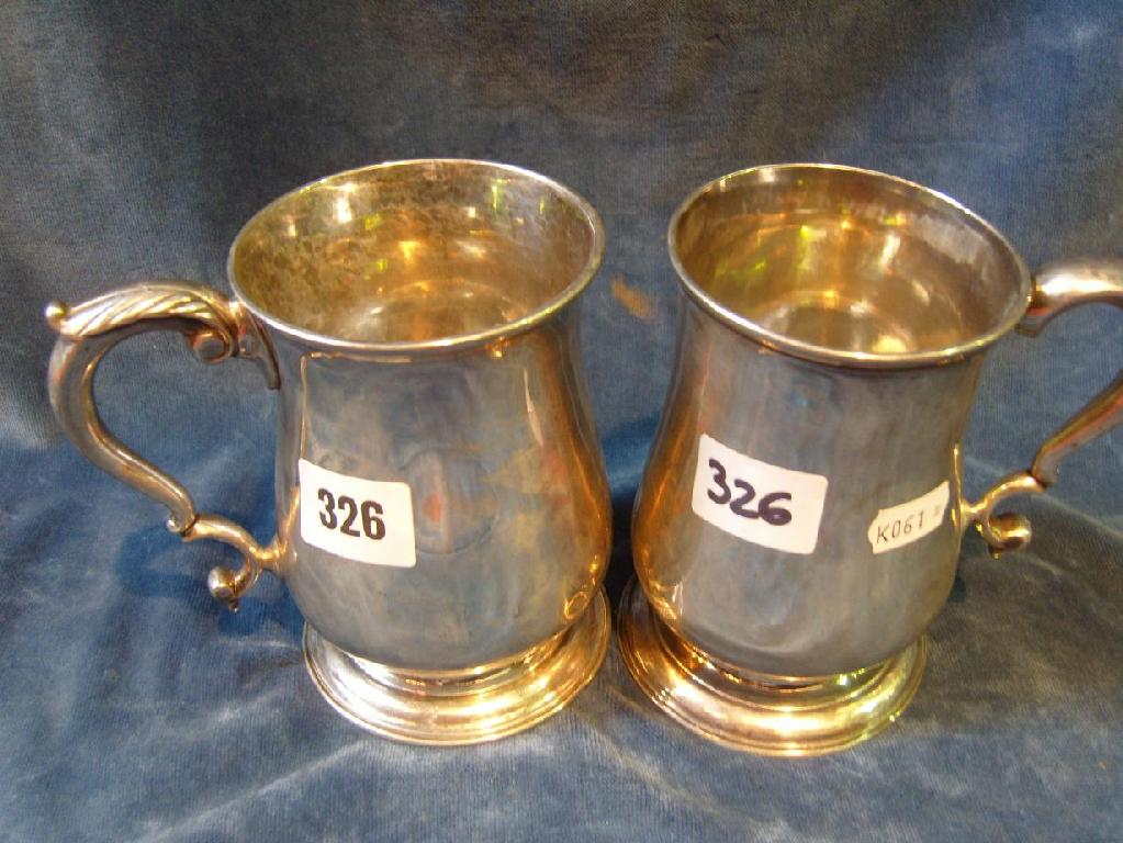 Appraisal: A Georgian silver tankard of baluster form shaped handle and