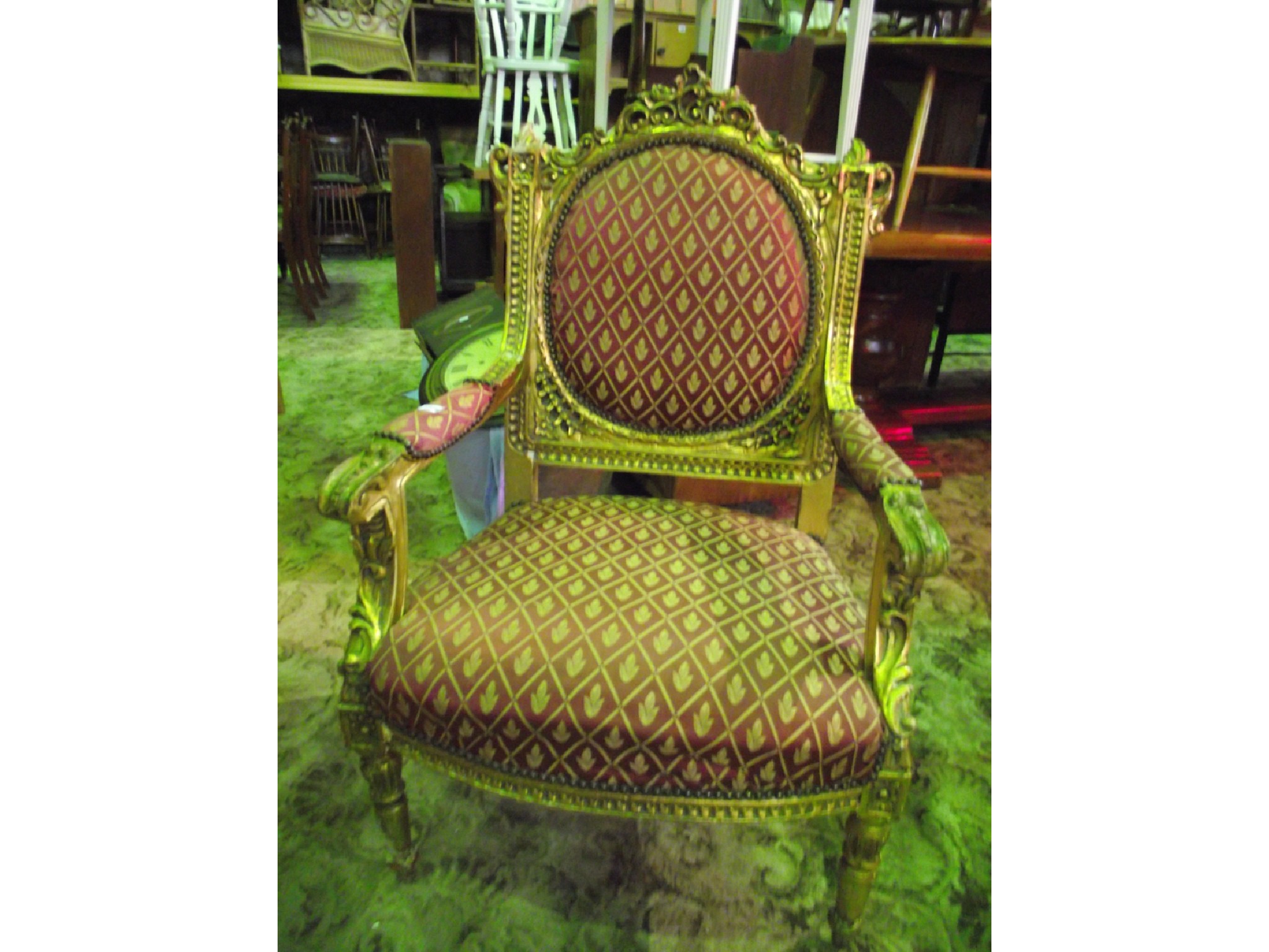 Appraisal: A fauteuils with floral lattice patterned upholstered sprung seat back