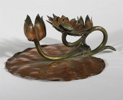 Appraisal: A Japoniste copper and brass chamberstick modelled as a leaf