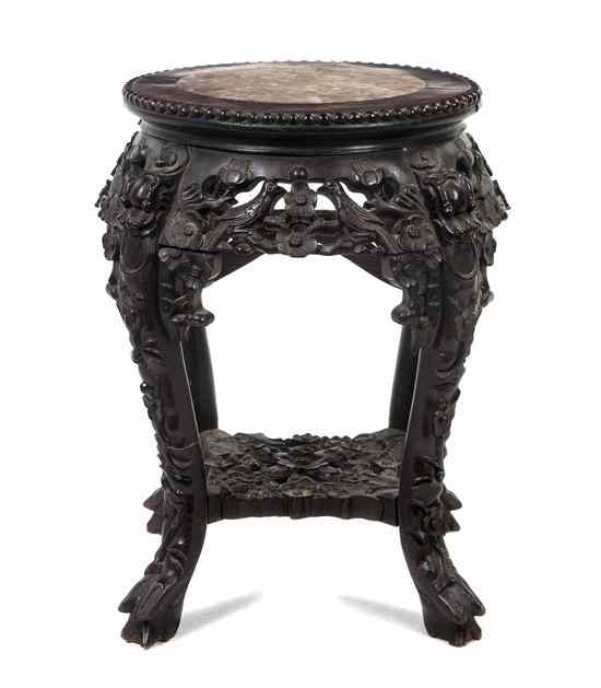 Appraisal: A Chinese Hardwood Stand the circular marble inset top with