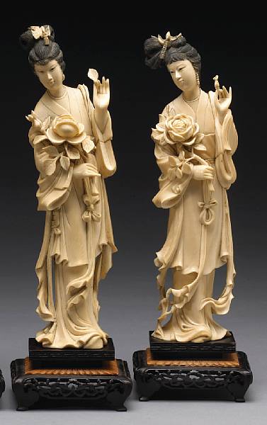 Appraisal: A pair of tinted ivory beauties th Century Standing in