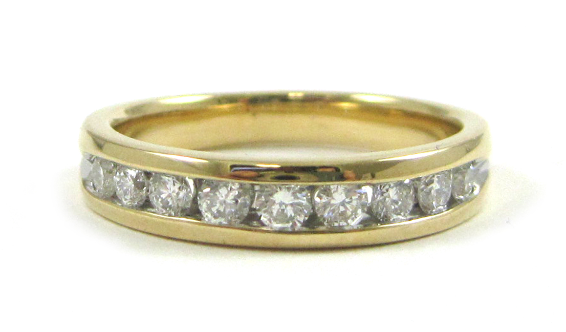 Appraisal: DIAMOND AND FOURTEEN KARAT GOLD RING set with nine round-cut