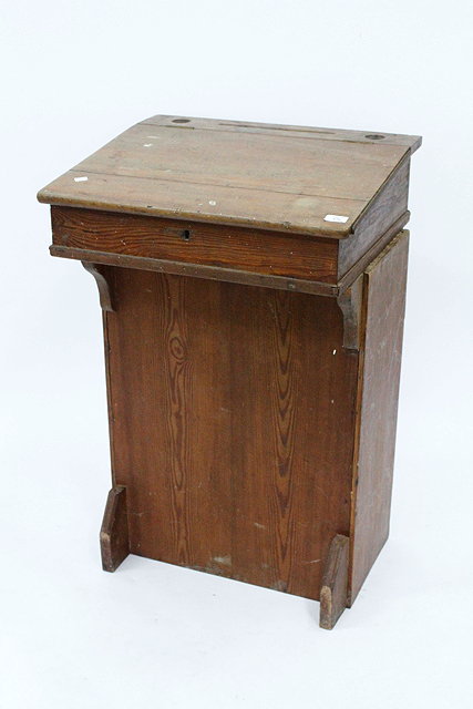 Appraisal: AN ANTIQUE PITCH PINE SCHOOL DESK with a sloped top