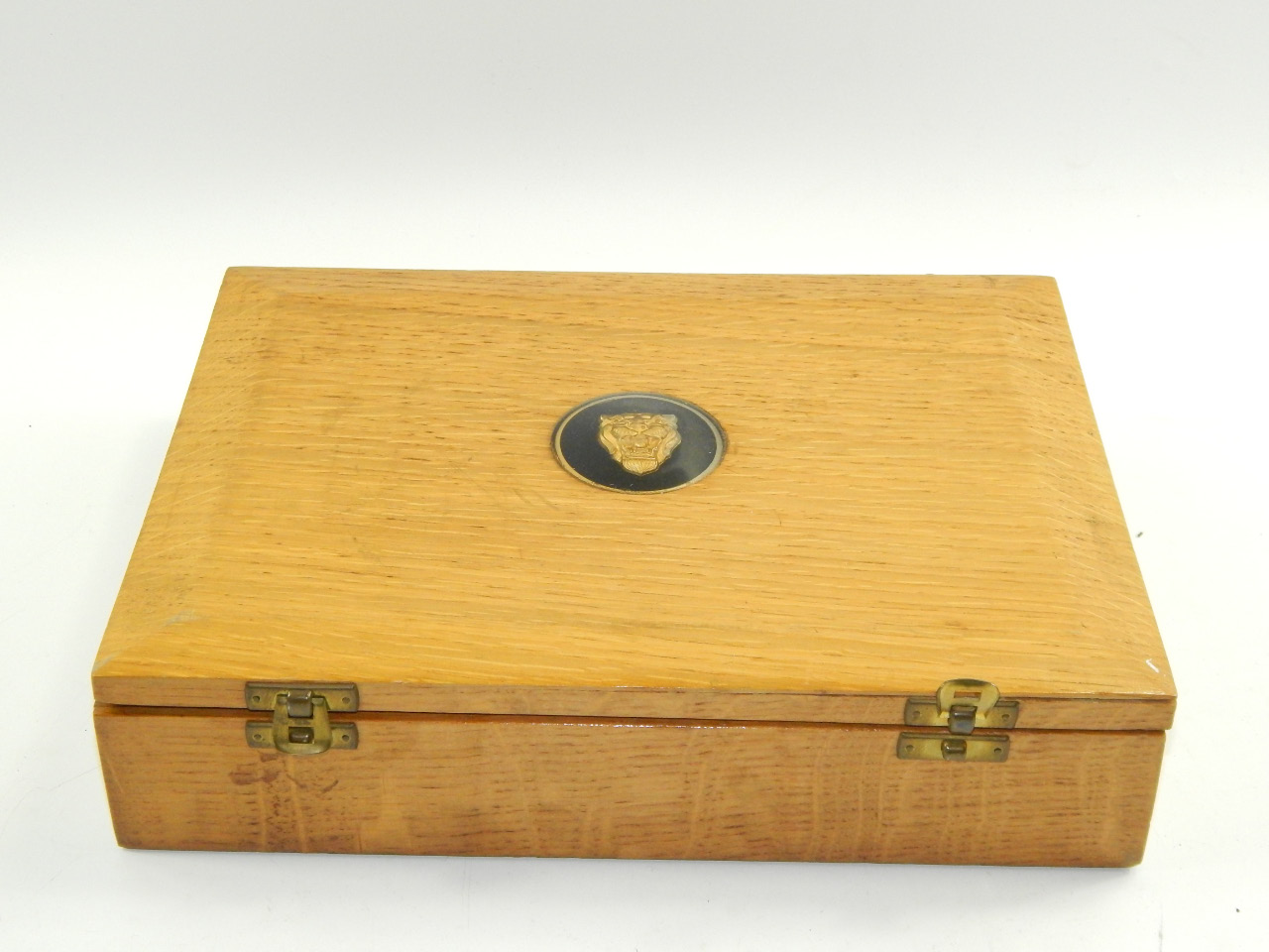 Appraisal: A Jaguar Cars oak box containing place mats