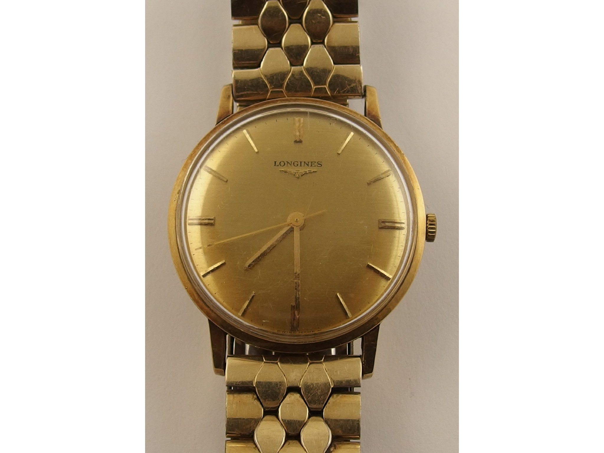 Appraisal: A ct Gent Longines watchwith a gold coloured dial with