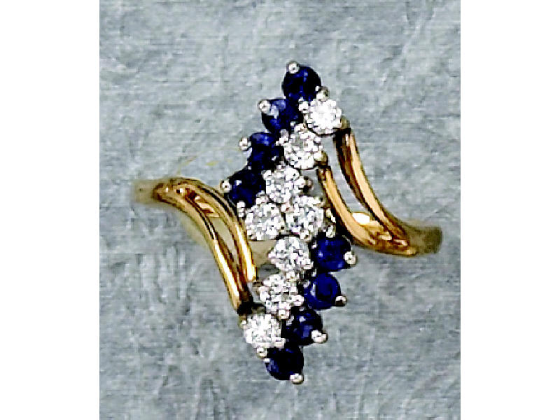 Appraisal: SAPPHIRE AND DIAMOND RING k yellow gold ring with double