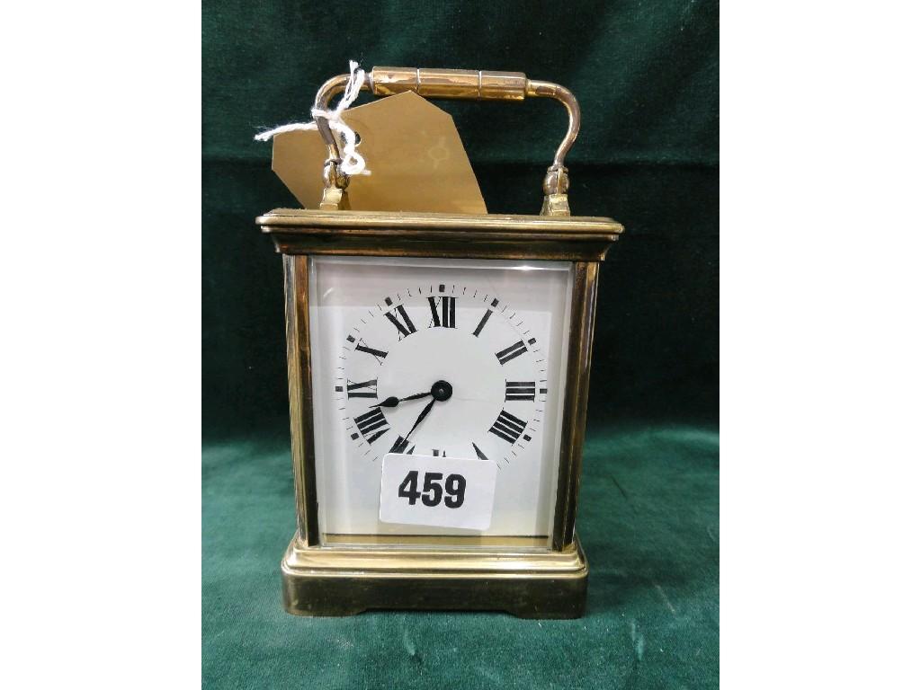 Appraisal: A brass carriage clock with loop handle and enamel dial