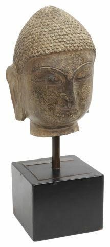 Appraisal: Carved stone head of the Buddha with tightly curled hair