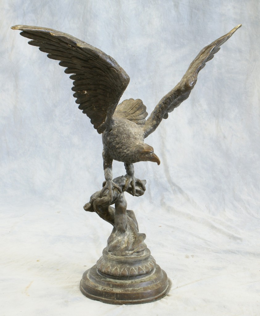 Appraisal: Cast bronze eagle on branch unmarked mid-late th C tall