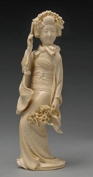 Appraisal: A large ivory figural okimono of a bijin Meiji Period