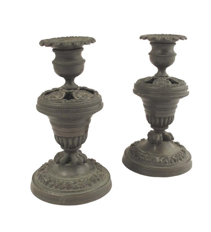 Appraisal: A pair of th century bronze pastille burner candlesticks