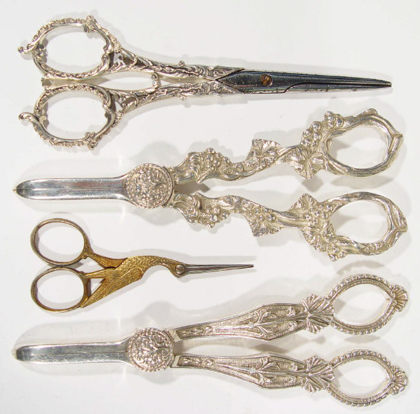 Appraisal: Pair of French silver handled grape scissors two pairs of