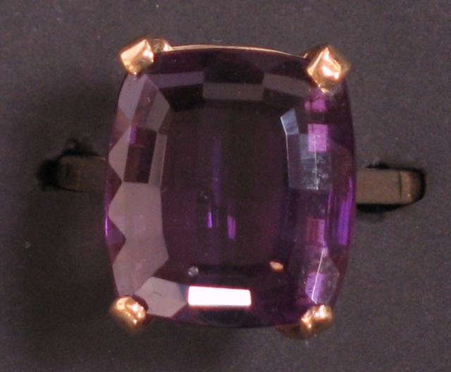 Appraisal: A LARGE CUSHION-CUT AMETHYST DRESS RING in a ct yellow