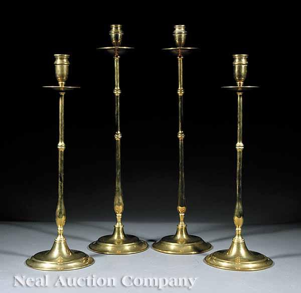 Appraisal: A Group of Four English Graduated Brass Candlesticks late th