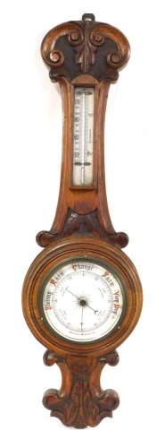 Appraisal: A late thC oak aneroid barometer with white ceramic dial