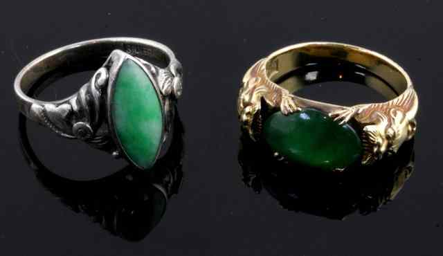 Appraisal: A Chinese ring set on oval jadiete stone with mythical