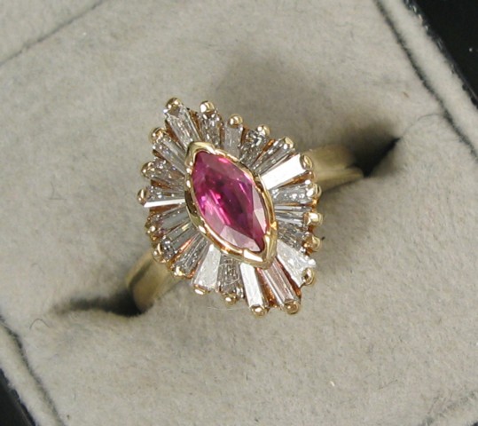 Appraisal: PINK SAPPHIRE AND DIAMOND RING k yellow gold centering a