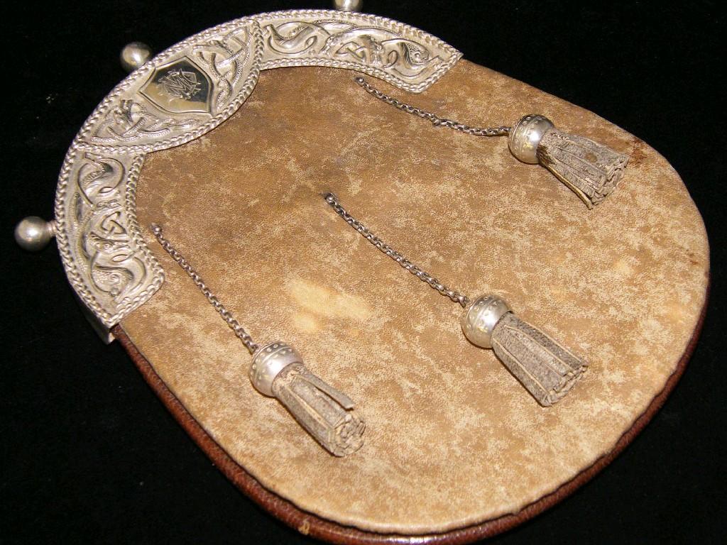 Appraisal: Interesting Scottish leather and silver mounted sporran impressed with the