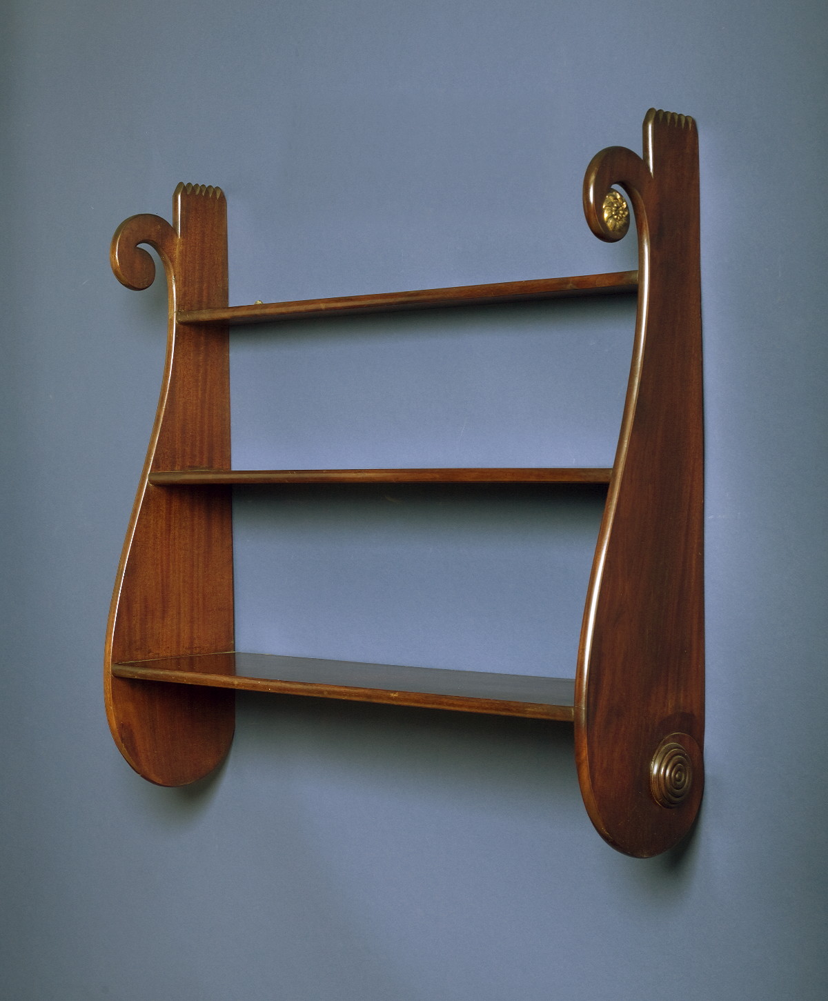 Appraisal: HONDURAS MAHOGANY WHALESIDE THREE-TIERED SHELF WITH SCROLLWORK DECORATION The upper