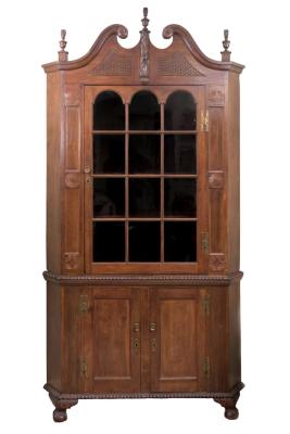 Appraisal: An American cherrywood standing corner cupboard circa the swan neck