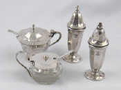 Appraisal: A silver panelled urn shaped cruet the mustard with liner