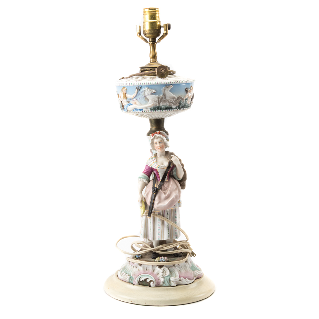 Appraisal: German porcelain figural oil lamp late th century mounted on