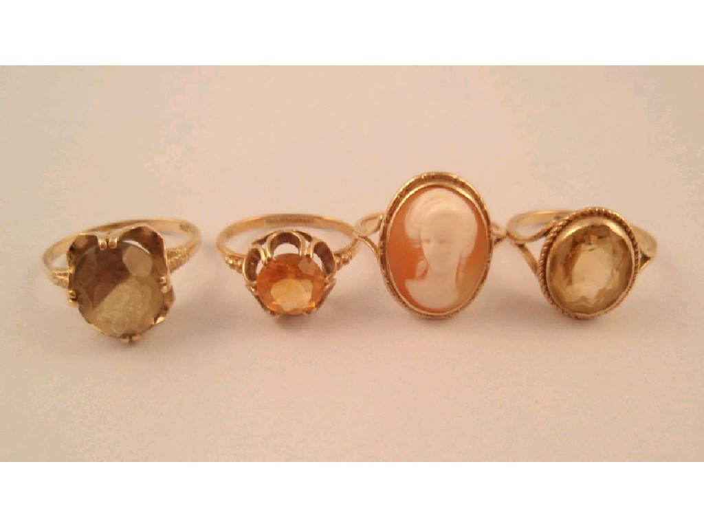 Appraisal: Three stone set rings and a cameo set ring