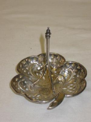 Appraisal: AN EDWARDIAN WATCH STAND of leaf form pierced and embossed